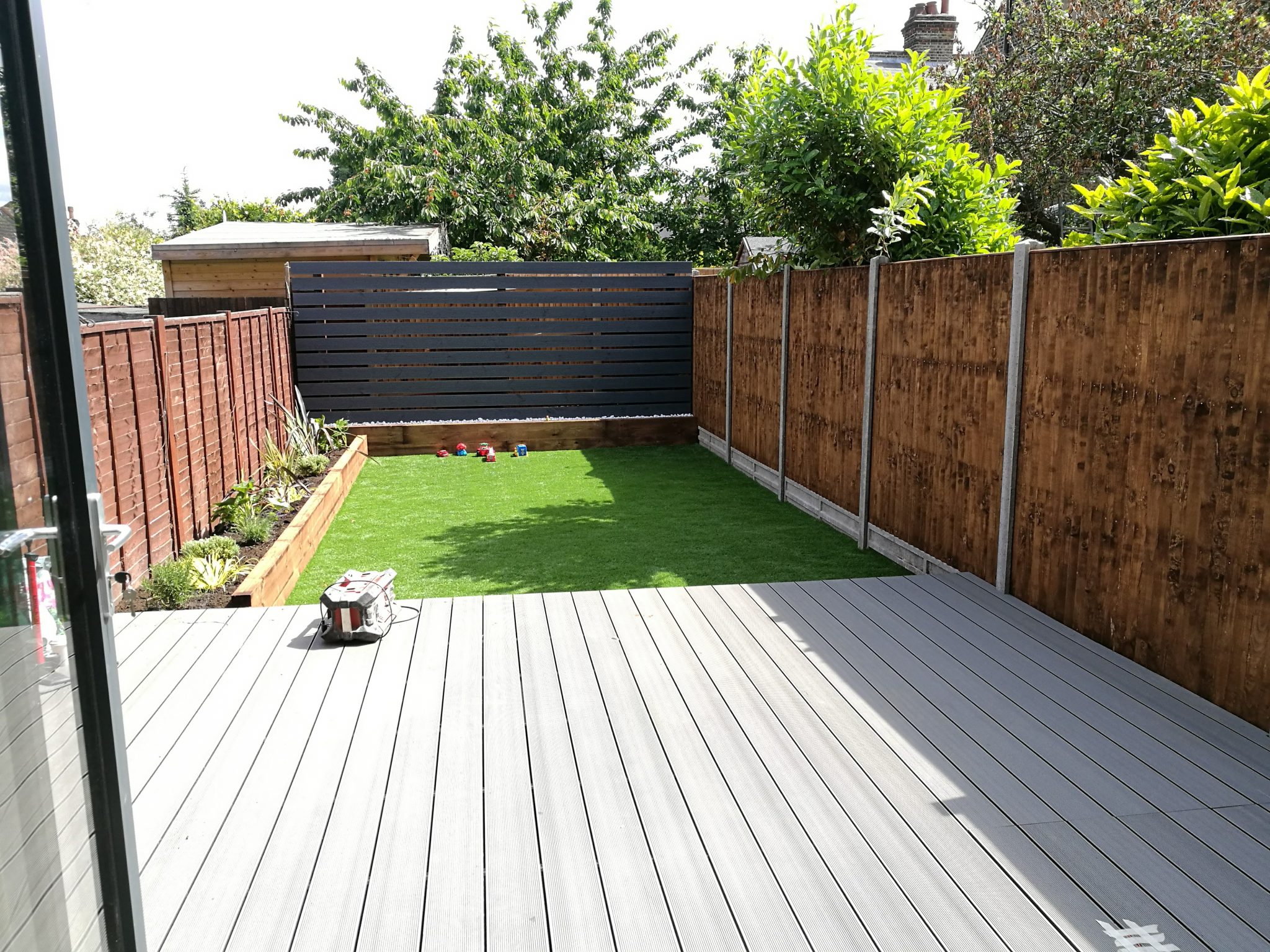 Decking and sleepers on border